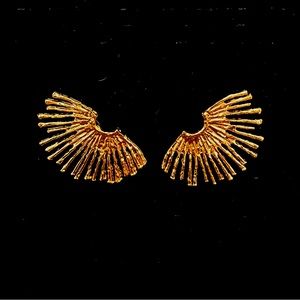 Bold gold earrings perfect for a night out